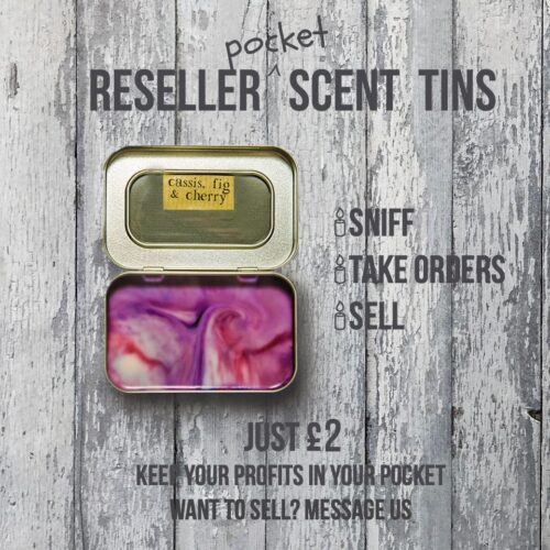 A small open tin featuring "Cassis, fig & cherry" scent, displayed on a wooden surface. Text reads "Pocket Reseller Scent Tins," "Just £2, keep your profits in your pocket," "Want to sell? Message us." with icons for sniffing, taking orders, and selling.