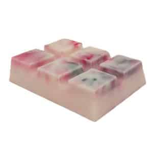 A rectangular piece of soap, resembling a Raspberry Daiquiri Snap Bar, with six square segments. The soap is white with swirls of pink and green throughout it, giving it a marbled appearance that mimics the vibrant hues of a Raspberry Daiquiri.